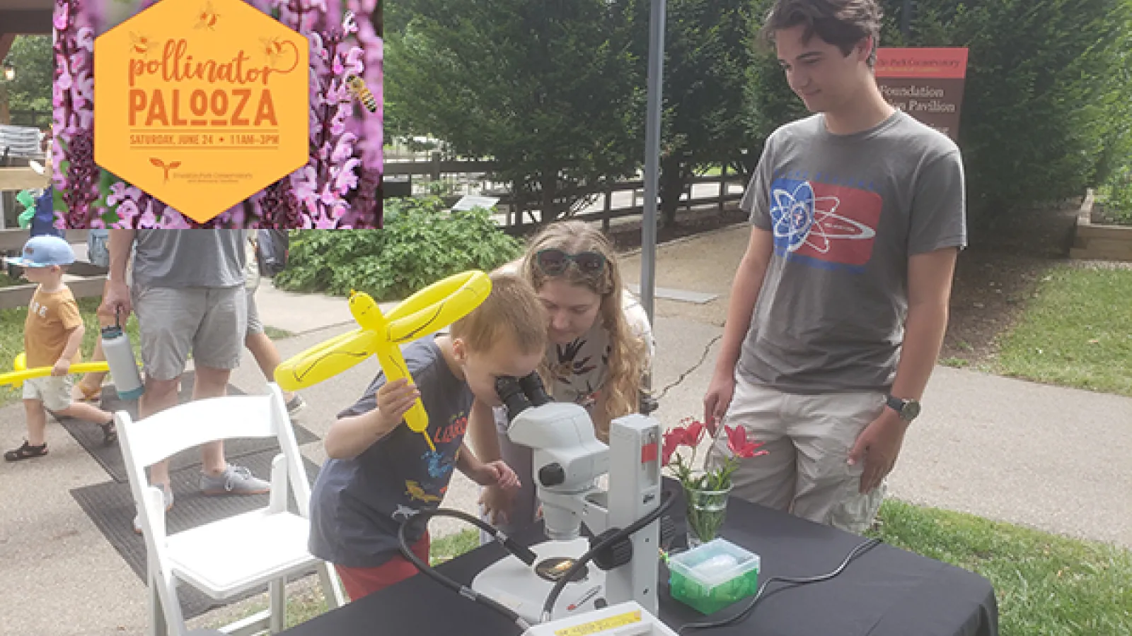 Young child using a microscope
