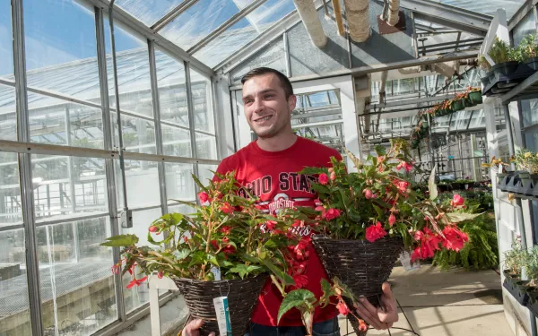 Student in greenhouse